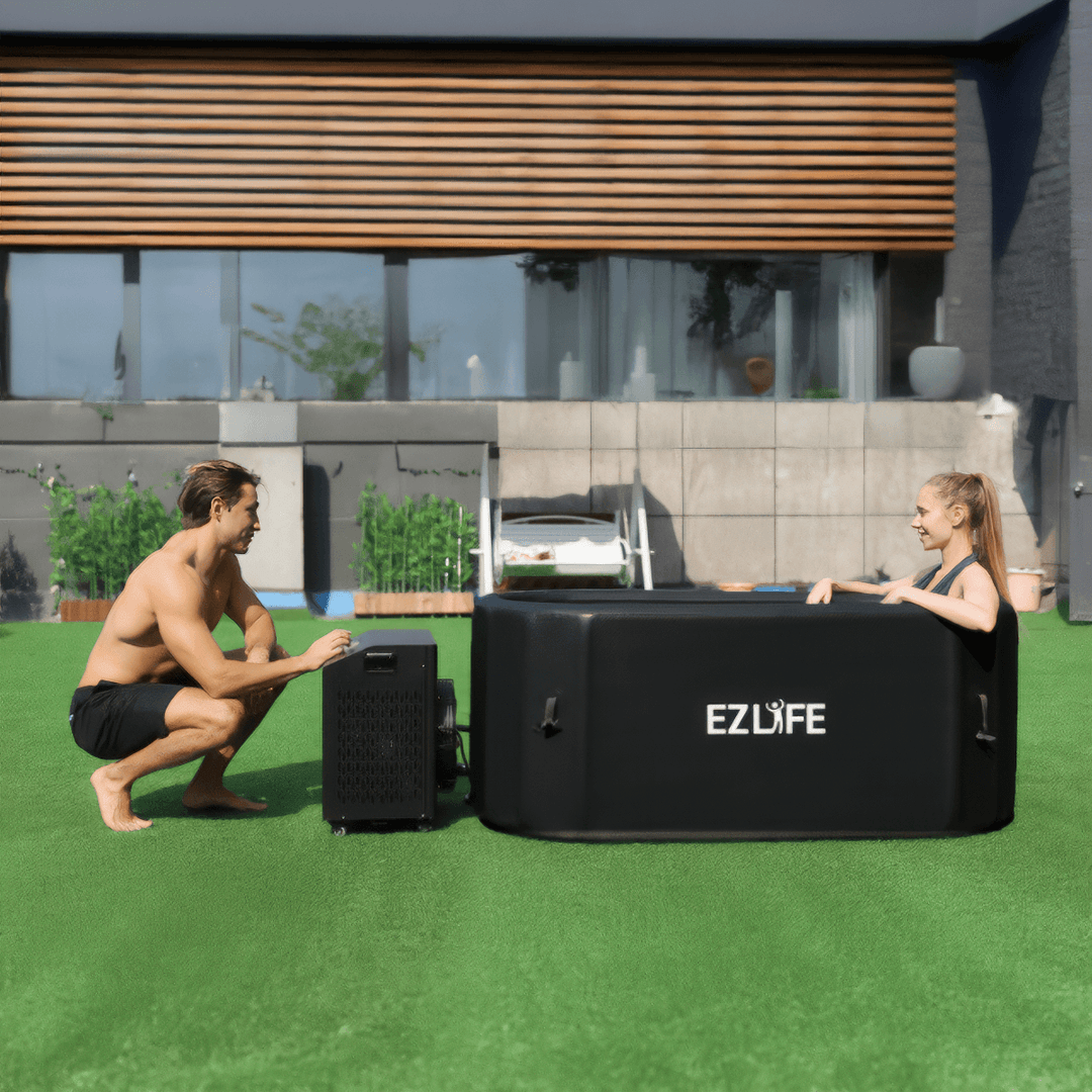 A couple outside enjoying their EZLIFE Inflatable Cold Plunge