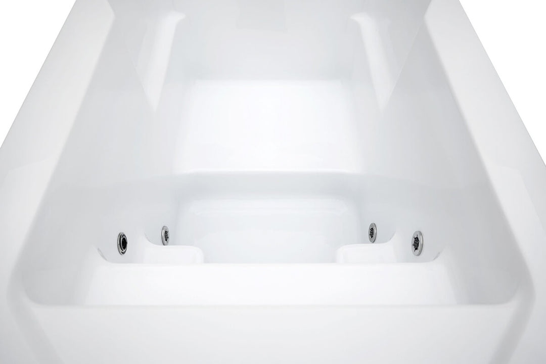 Empty cold plunge tub, showing the four jets contained in the tub.