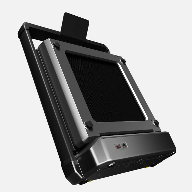 An angled view of the walkingpad stored in compact storage mode.