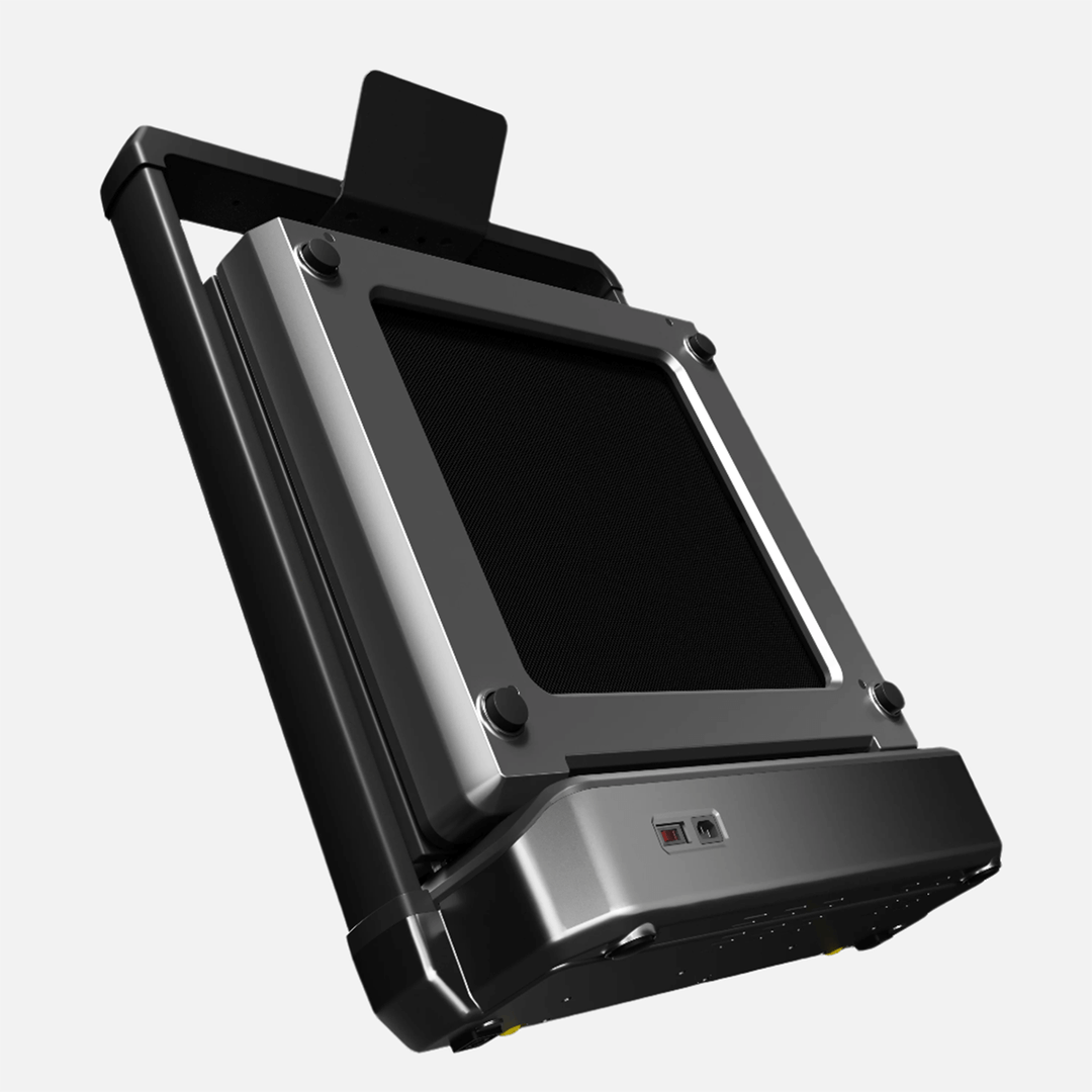 An angled view of the walkingpad stored in compact storage mode.
