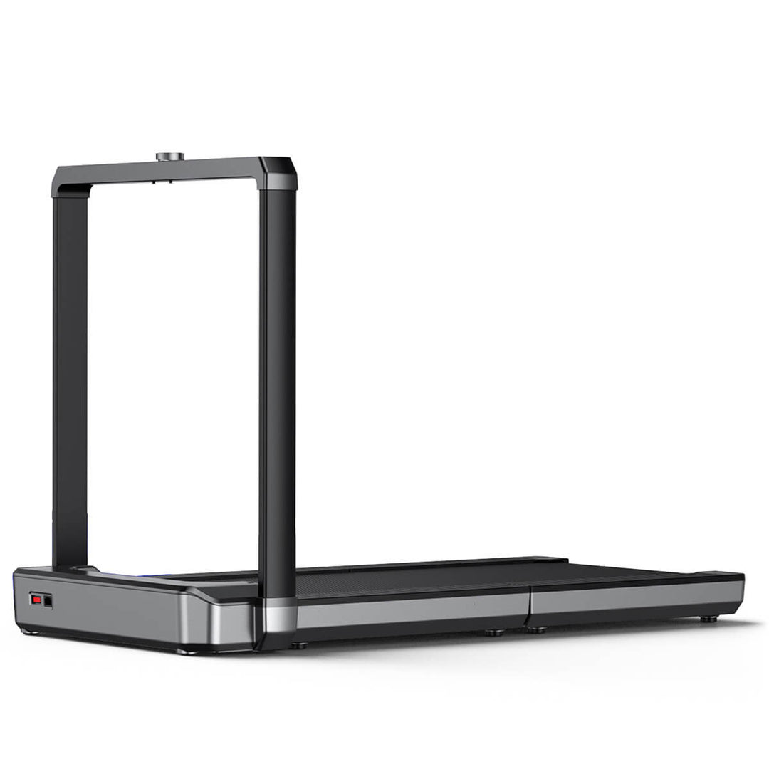 Gray and black Walkingpad treadmill in upright position on white background.