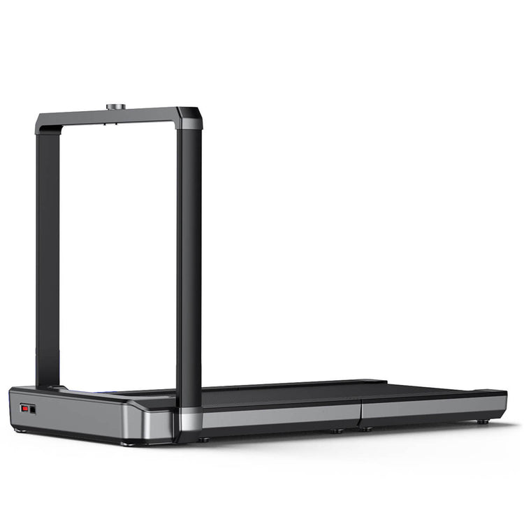 Gray and black Walkingpad treadmill in upright position on white background.