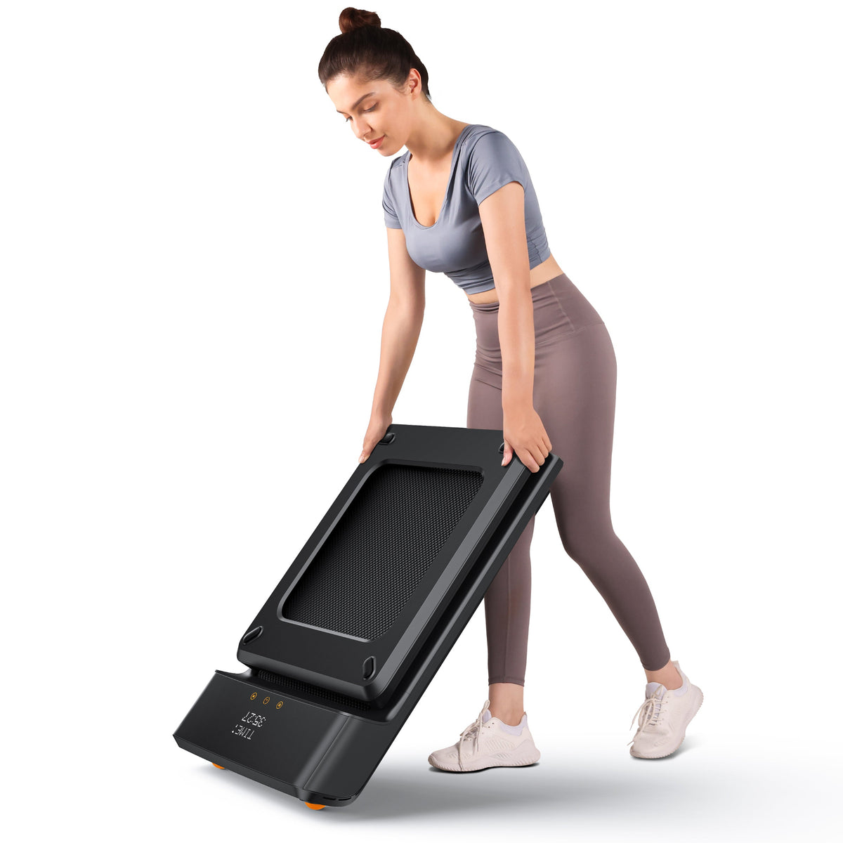 Woman holding A1 Pro Walkingpad walking pad on white backgorund