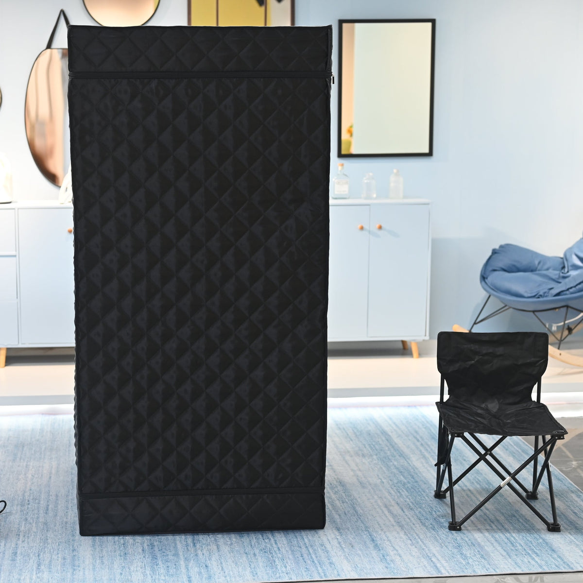 Ezlife black steam sauna with black chair next to the side 