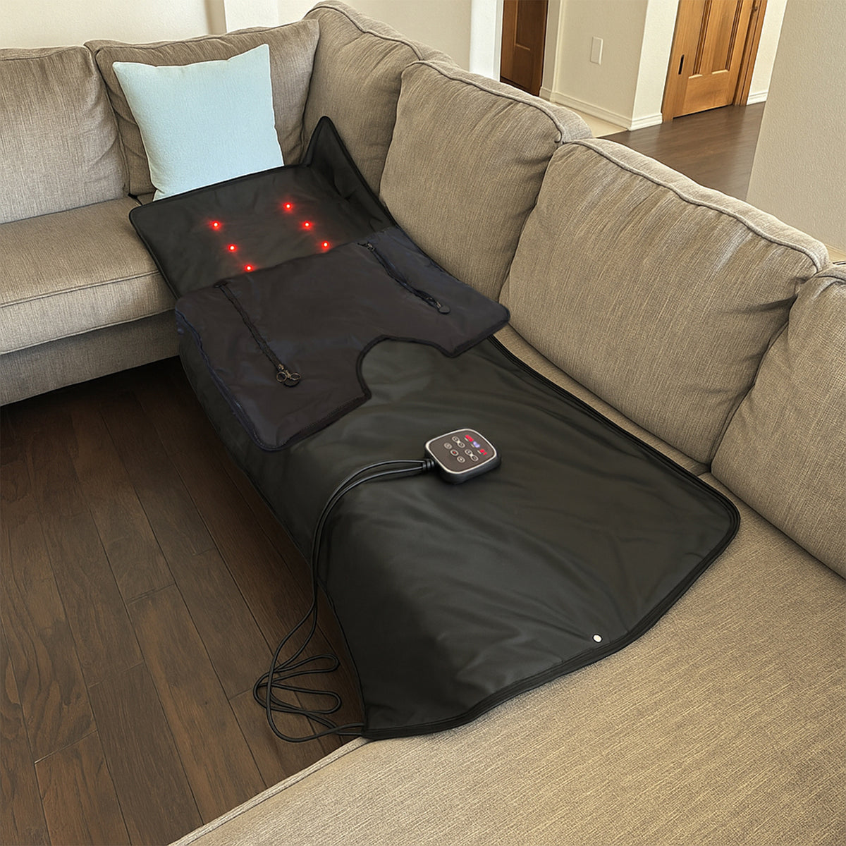 Ezlife Red Light Sauna Blanket laying on couch. 