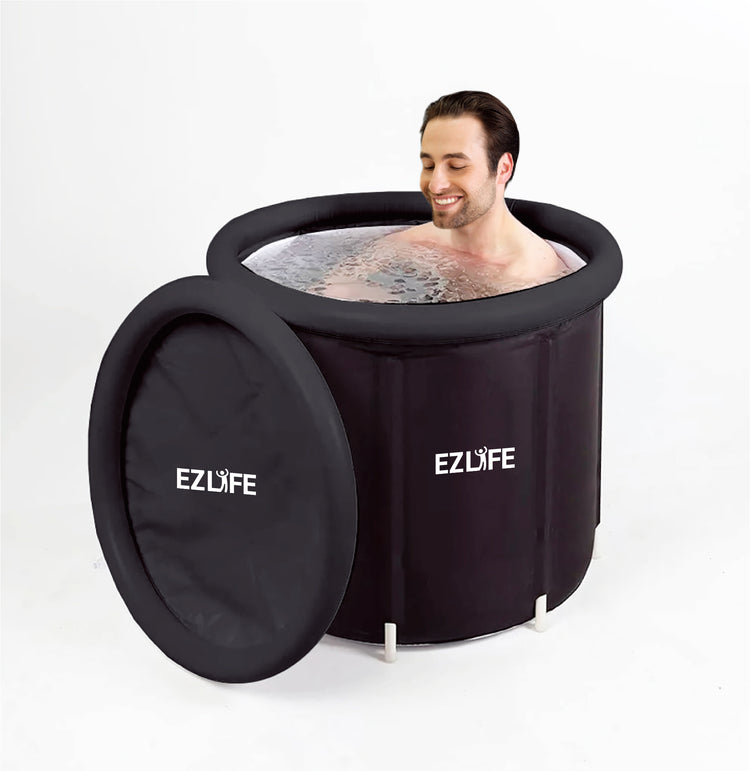 Man taking a cold plunge in Inflatable Ice Bath, black tub with "EZLIFE" logo on it on white background.