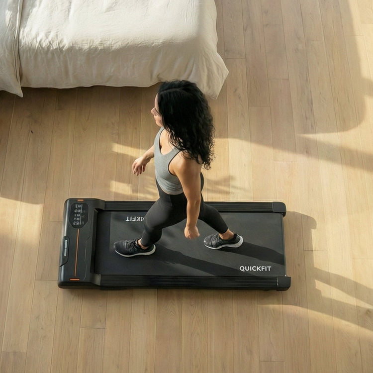 Woman exercising on a treadmill in a modern bedroom
