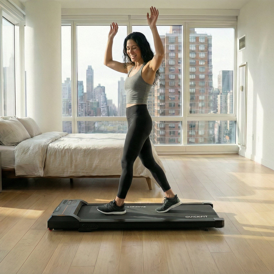 Fit woman losing weight while walking at home in her apartment