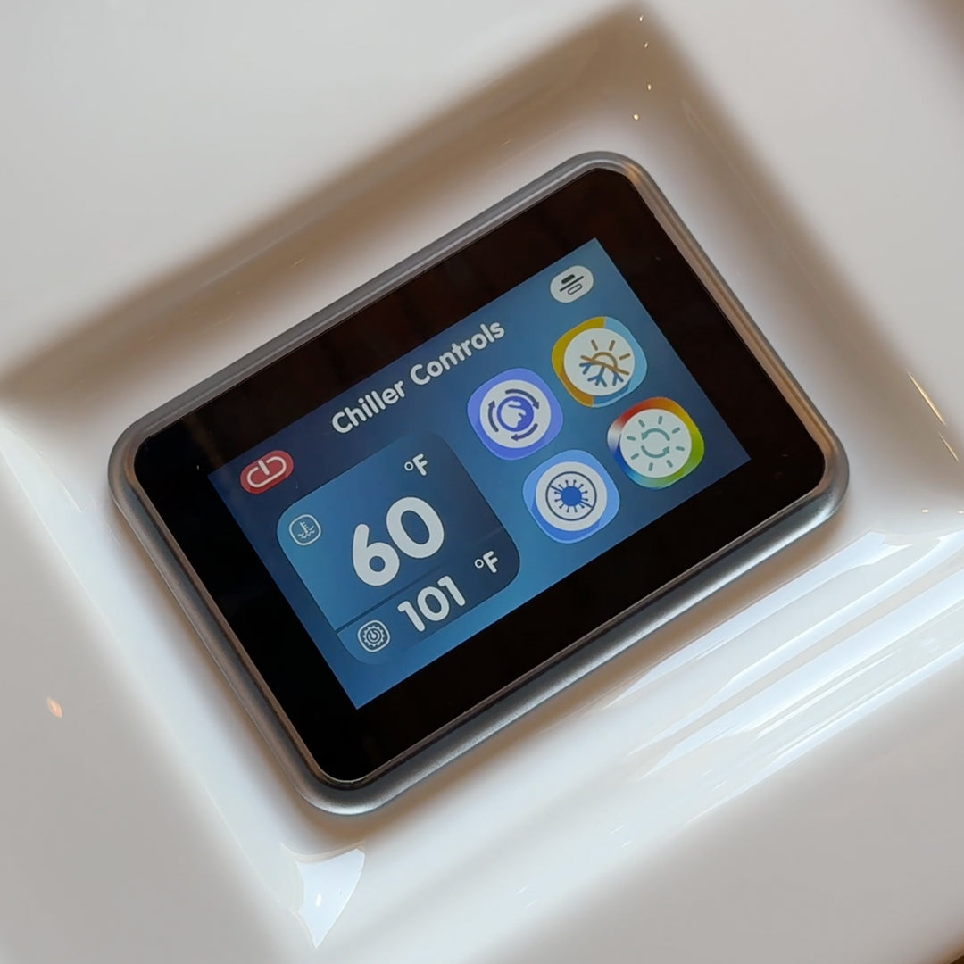 Digital display showing chiller controls with temperature readings on a white surface