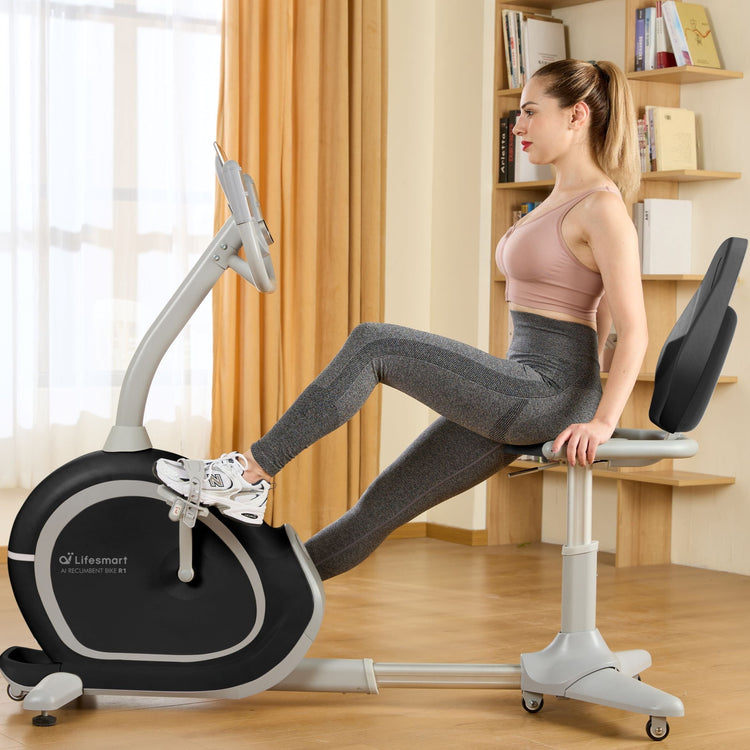 Woman in workout clothes exercising on R1 Smart Recumbent in her home. 