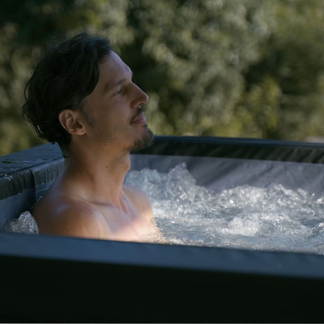 Man relaxing in bubbly water.