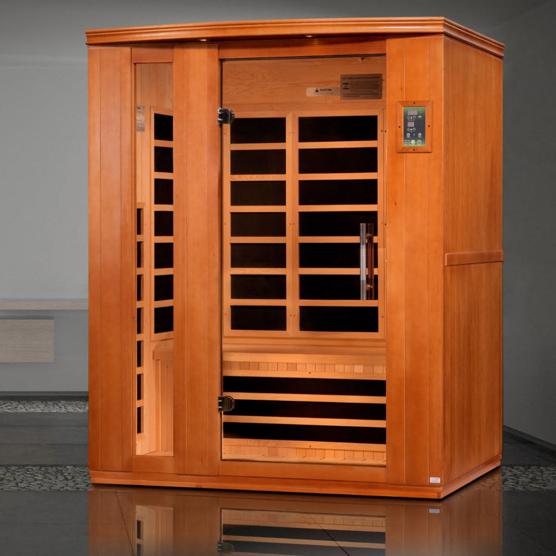 Infrared home sauna with glass door, wood frame, and interior carbon heaters in clean lifestlyle home setting.