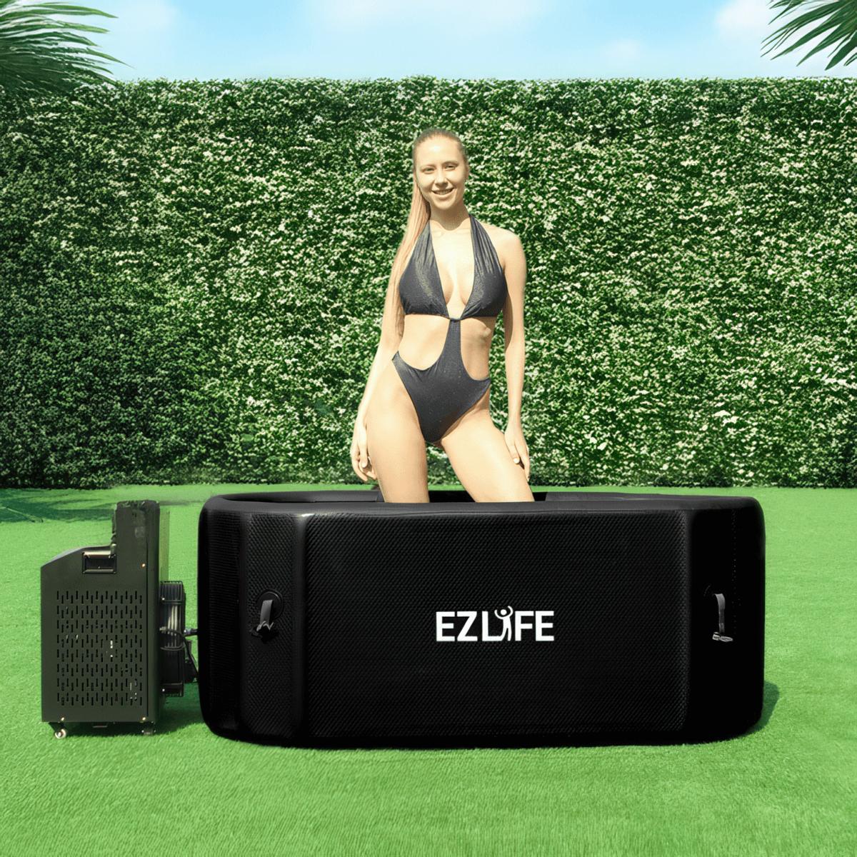 A woman standing in the EZLIFE Oval Inflatable Cold Plunge