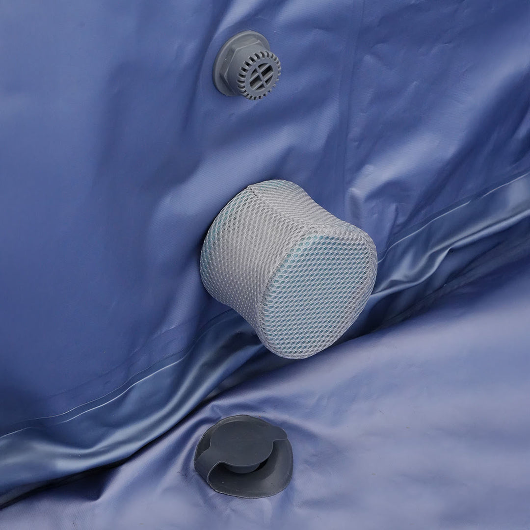 An interior view of all the ports and drains, with a mesh cover to protect from debris.