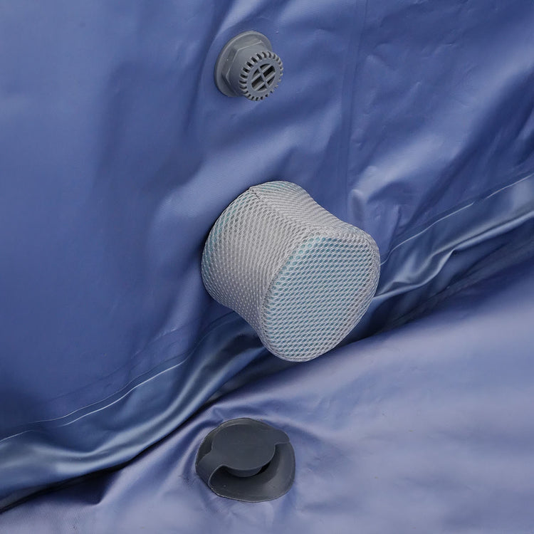 An interior view of all the ports and drains, with a mesh cover to protect from debris.