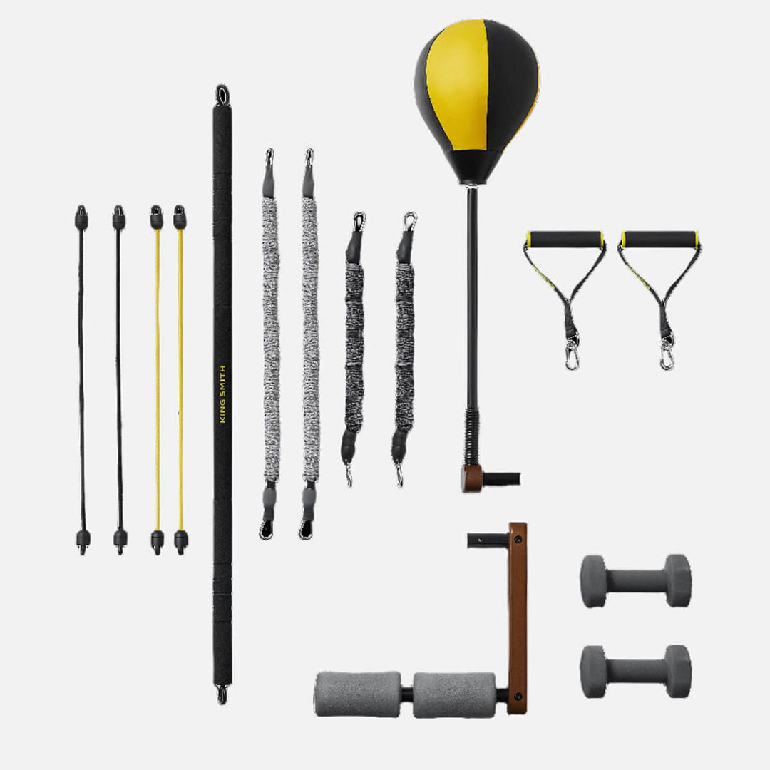 A gray and white exercise bands with a yellow and black punching bag and other accessories shown on a white background.