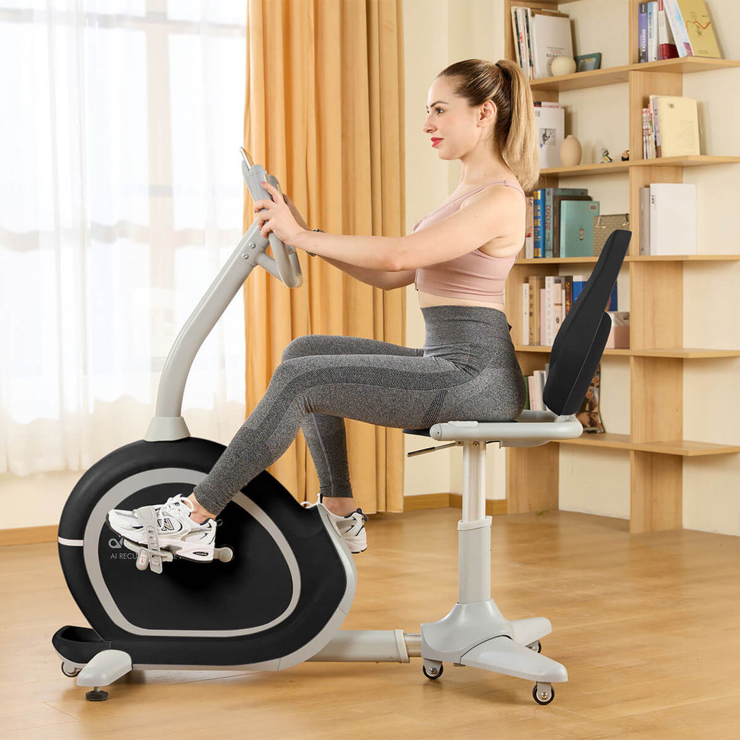 Woman working out on recumbent bike with the camera angle at a profile/side angle.