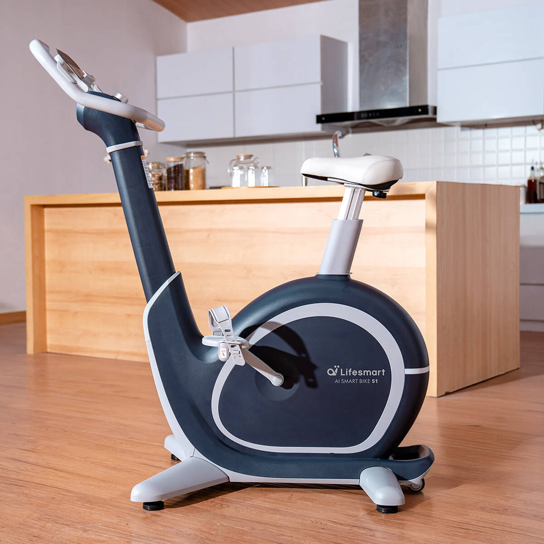 Profile view of S1 smart bike in home setting.