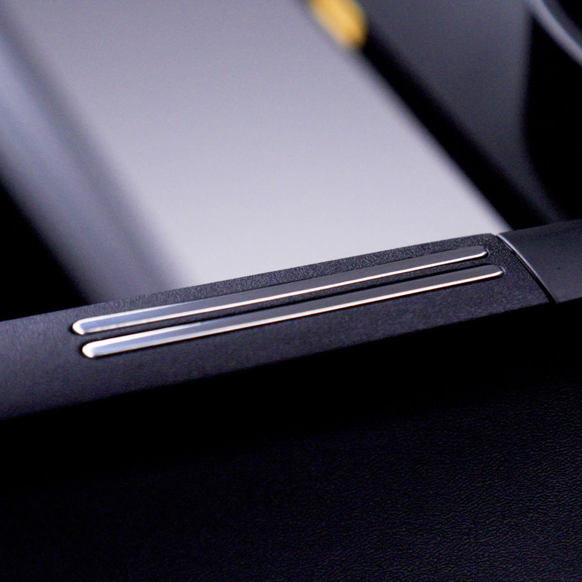 A close up of the EKG pulse sensor on the side rail.