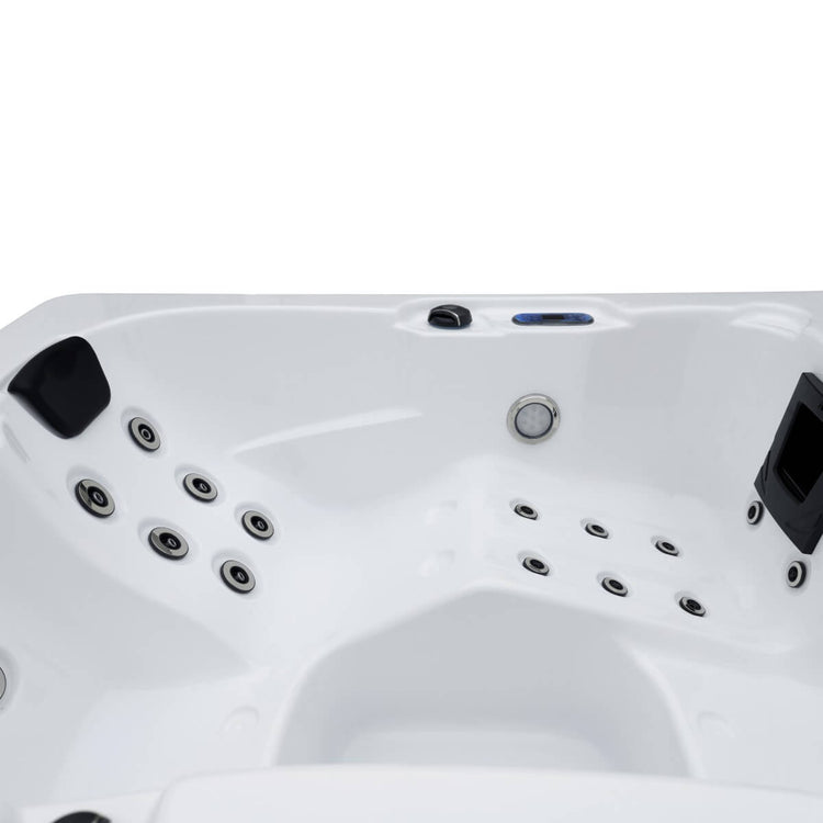 Close up of jets and head rest with white interior of spa.