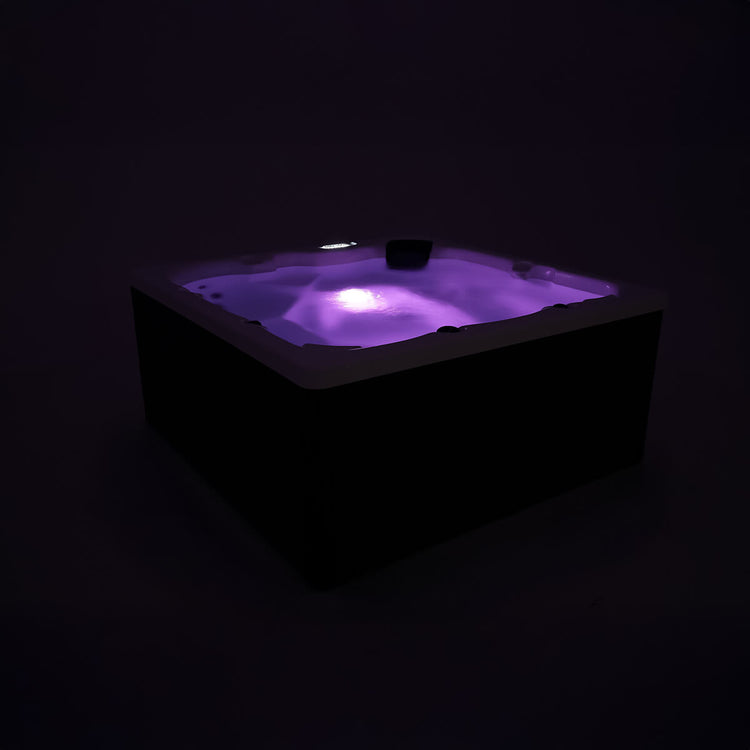 Spa filled with water and interior light turned on to create mood lighting.