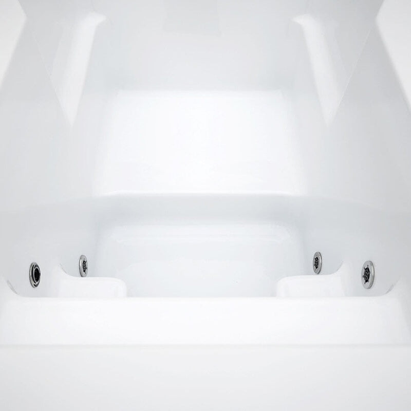 Empty cold plunge tub, showing the four jets contained in the tub. 