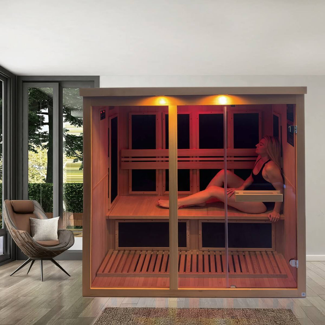 Woman sitting inside of sauna inside a home setting.